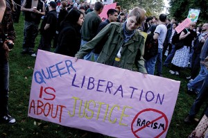 queer liberation banner in a protest